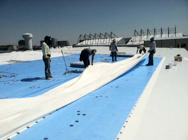 PVC Roof being Installed - Polyvinyl Chlorid - Nelson Roofing Company