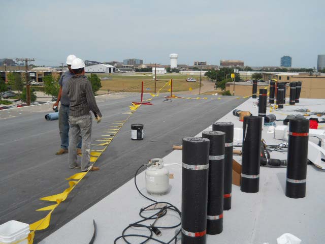 Modified Bitumen Roof being Installed